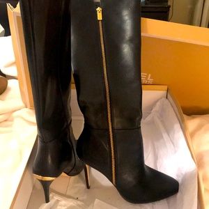 Nice heels boots new never used. Too small for me